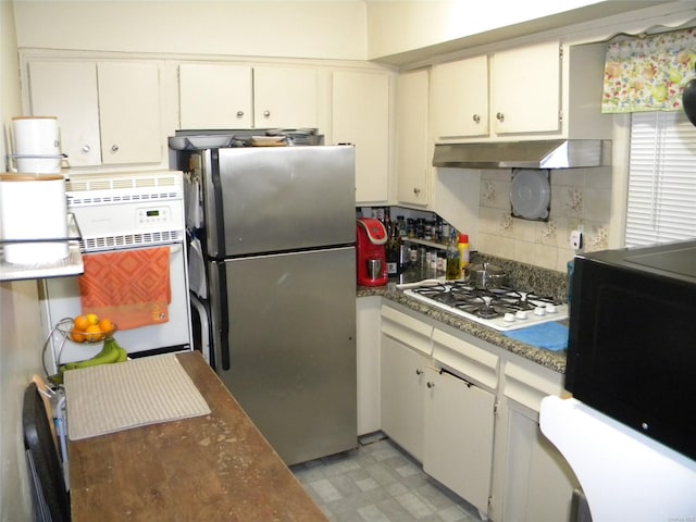 kitchen with white cabinets, white appliances, and tasteful backsplash