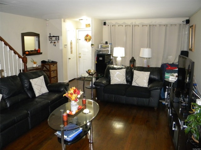 living room with dark hardwood / wood-style flooring