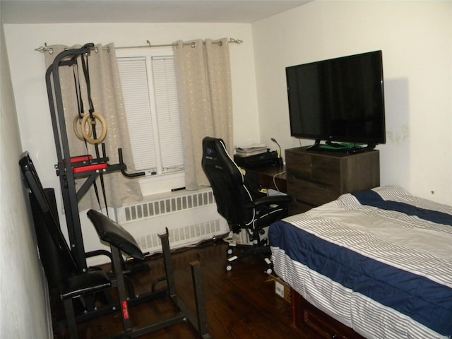 bedroom featuring dark wood-type flooring and radiator