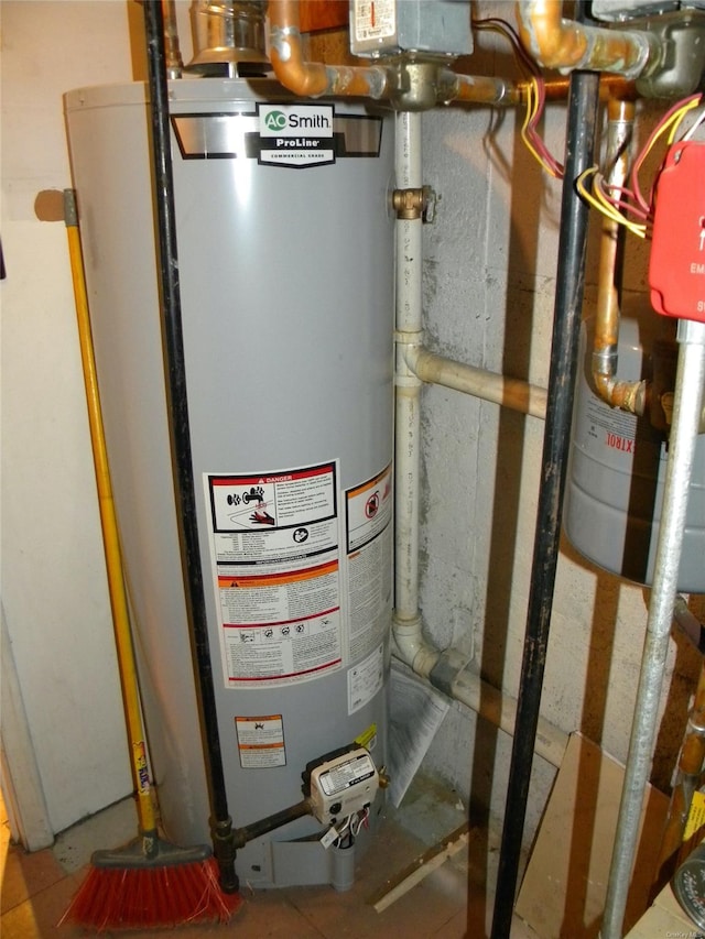 utility room featuring water heater