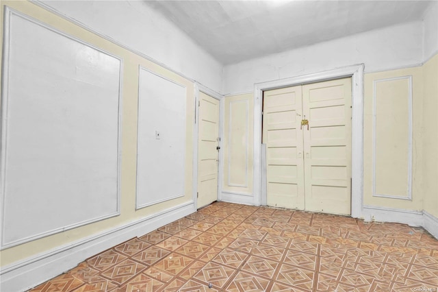 entryway with light tile patterned floors