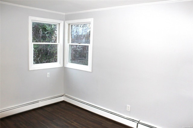 unfurnished room with hardwood / wood-style floors, crown molding, and a baseboard heating unit