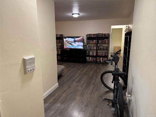 hall with dark wood-type flooring