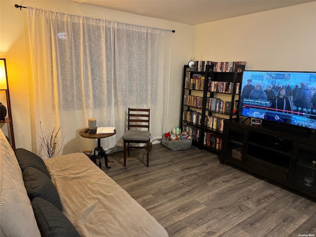 sitting room with wood-type flooring