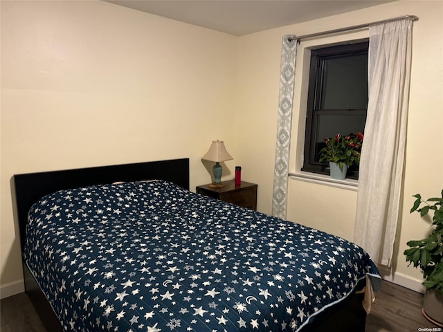 bedroom featuring dark wood-type flooring