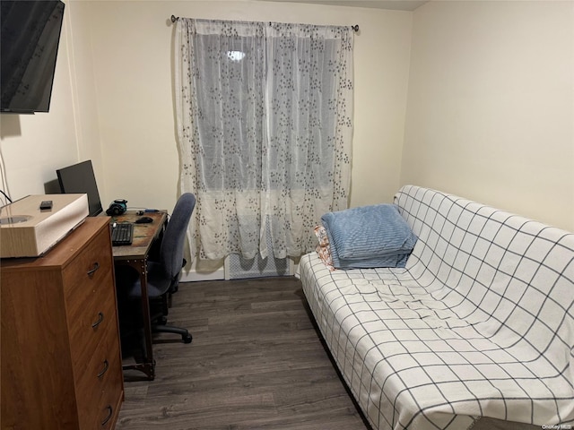 bedroom featuring dark hardwood / wood-style flooring