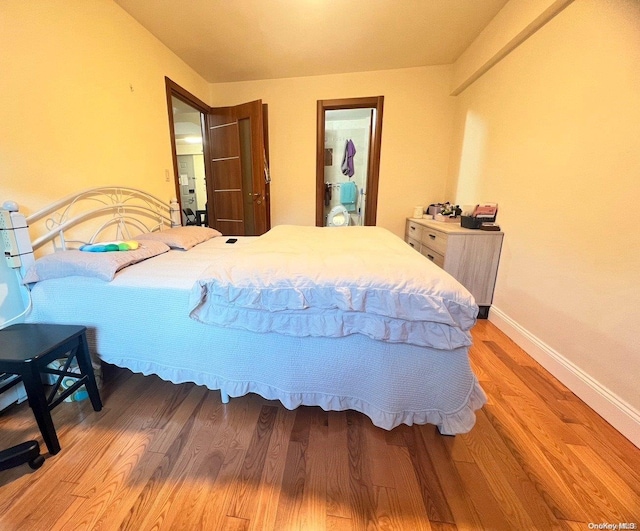 bedroom with hardwood / wood-style floors