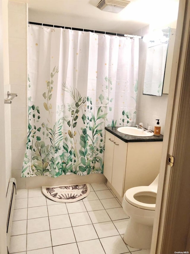 bathroom featuring vanity, tile patterned flooring, a shower with shower curtain, toilet, and baseboard heating