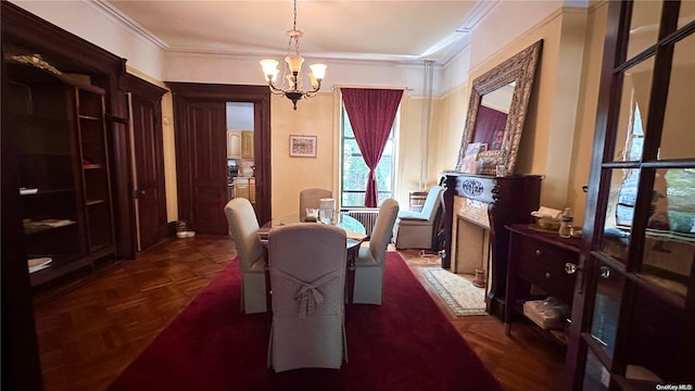 dining room with dark parquet flooring, crown molding, and an inviting chandelier