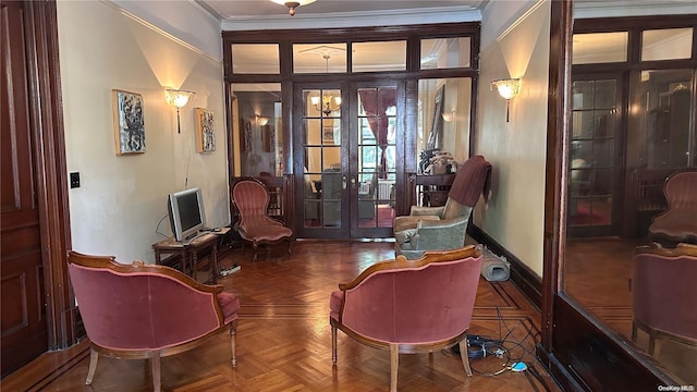 living area with parquet floors, crown molding, and french doors