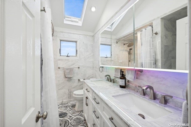 bathroom with vanity, lofted ceiling with skylight, toilet, walk in shower, and tile walls