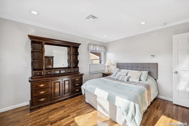 bedroom featuring dark hardwood / wood-style floors and ornamental molding