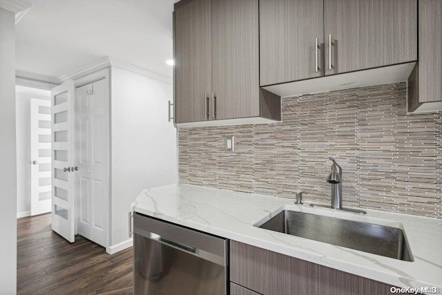 kitchen featuring light stone countertops, dishwasher, sink, dark hardwood / wood-style floors, and ornamental molding