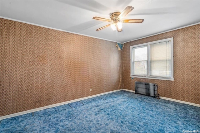 unfurnished room featuring ceiling fan, radiator heating unit, and dark carpet