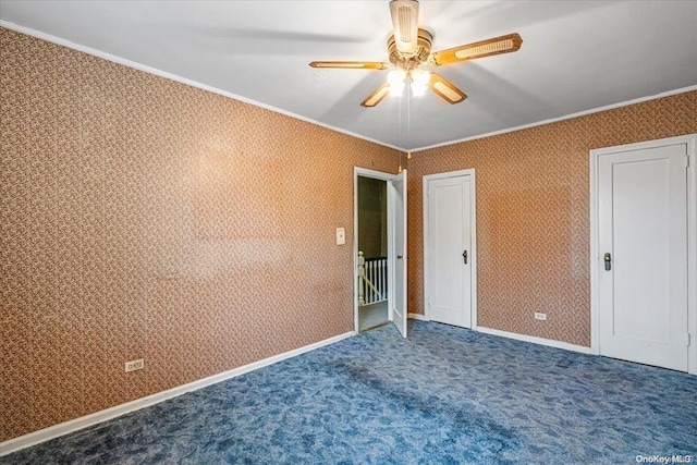 unfurnished bedroom with ceiling fan, ornamental molding, and carpet floors