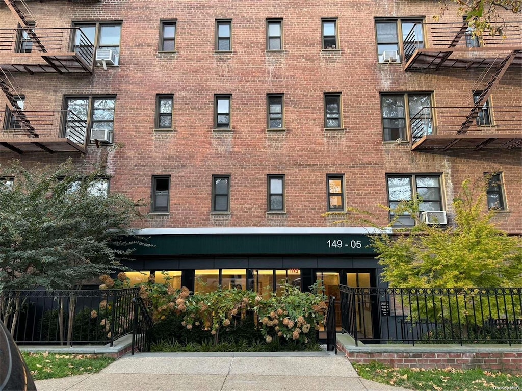 view of building exterior with cooling unit