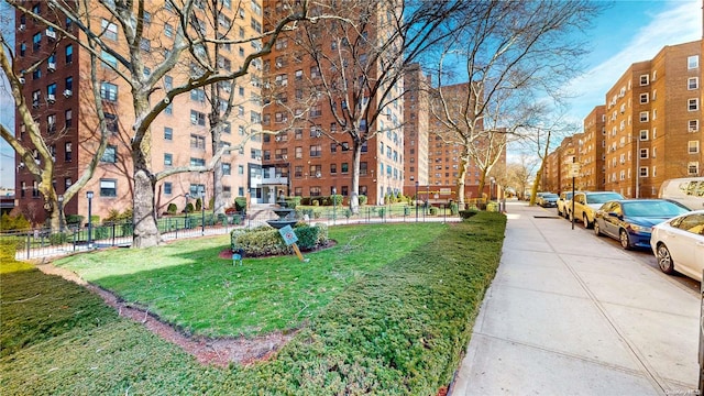 view of property's community with a yard