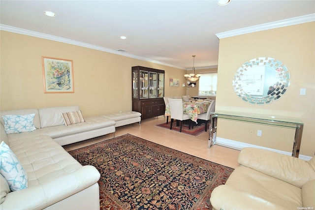 1070 Mckinley St, Baldwin, NY 11510 - living room featuring wood finished floors, crown molding, recessed lighting, and baseboards