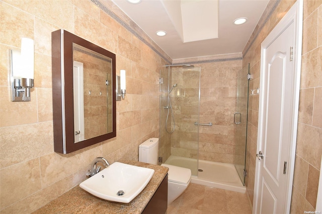 1070 Mckinley St, Baldwin, NY 11510 - full bathroom featuring tile walls, vanity, toilet, a shower stall, and recessed lighting