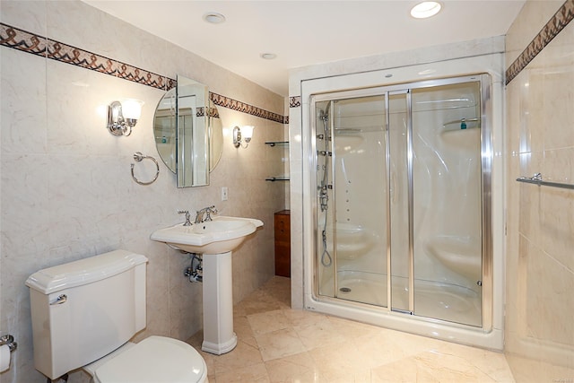 bathroom with toilet, an enclosed shower, and tile walls