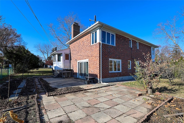 back of house featuring a patio area