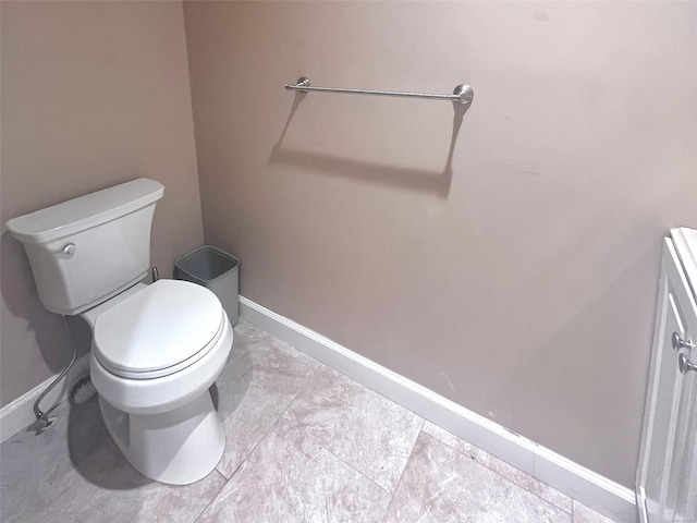 bathroom featuring tile patterned floors and toilet