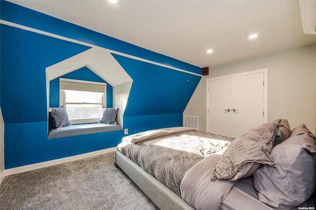 carpeted bedroom featuring lofted ceiling