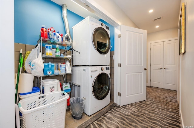 laundry room with stacked washer and dryer