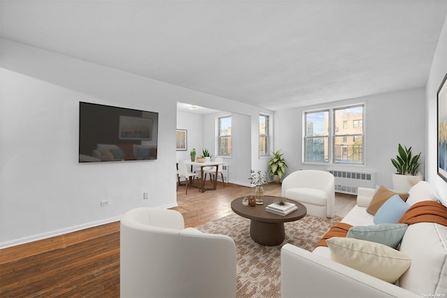 living room featuring hardwood / wood-style floors and radiator