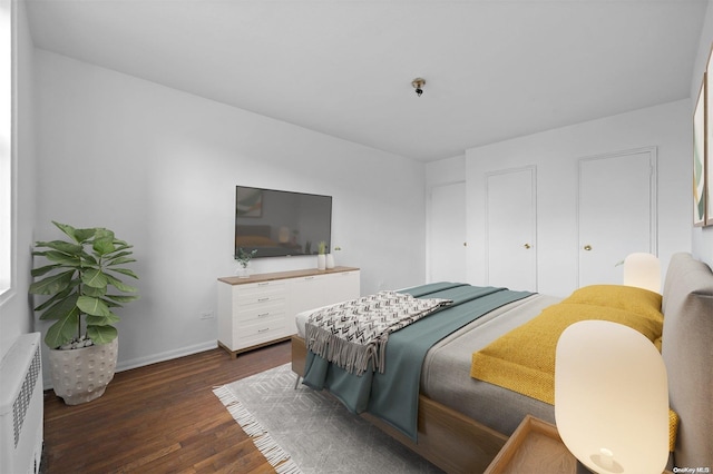 bedroom featuring dark hardwood / wood-style flooring