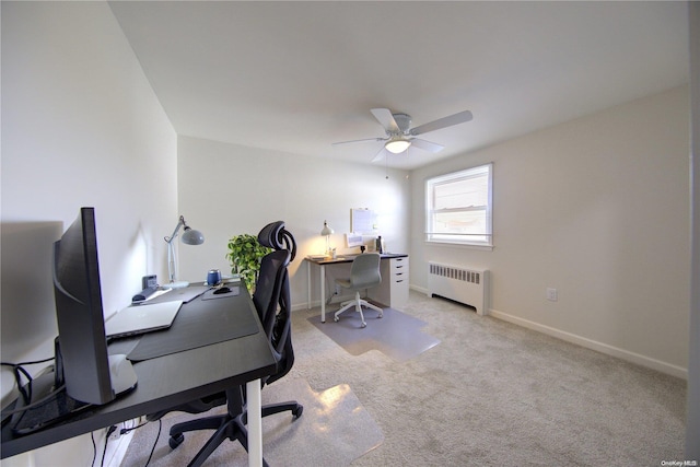 carpeted office featuring radiator and ceiling fan