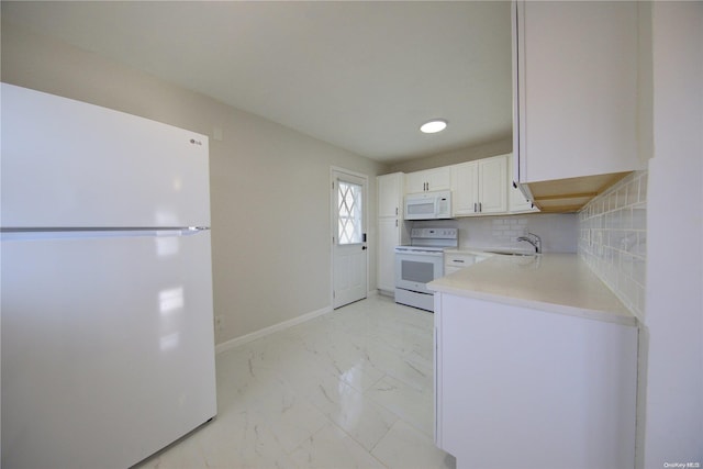 kitchen featuring white cabinets, decorative backsplash, white appliances, and sink