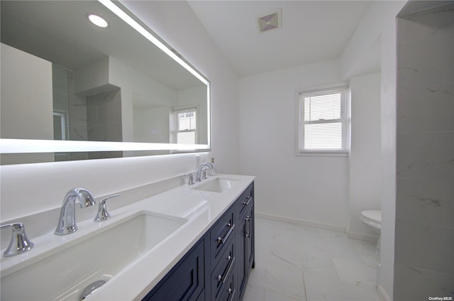 bathroom with vanity and toilet