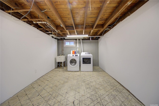 washroom with independent washer and dryer and sink