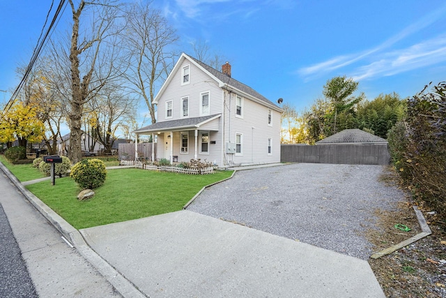 view of front of house with a front lawn and covered porch