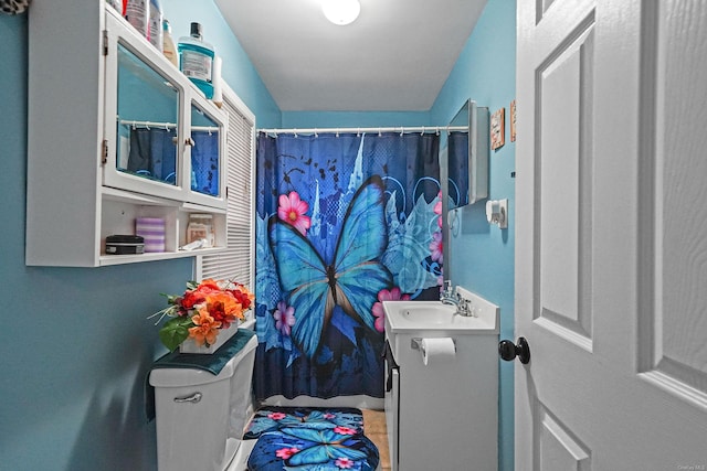 clothes washing area with a sink and tile patterned floors