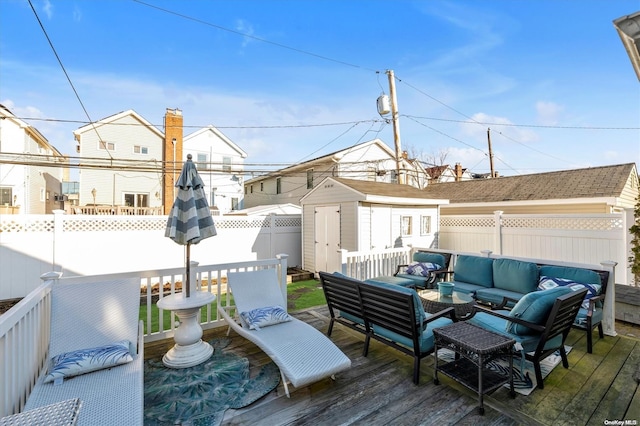 deck with an outdoor living space and a storage unit