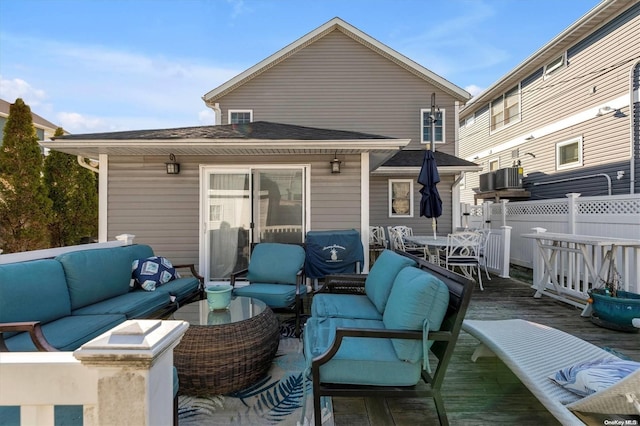 rear view of property with outdoor lounge area