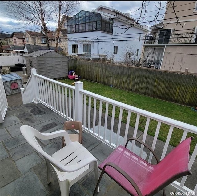 view of patio / terrace with a storage unit