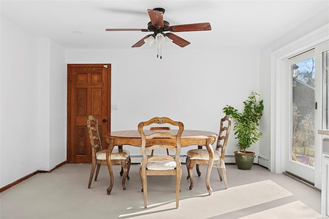 dining space featuring a baseboard radiator and ceiling fan