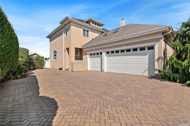 view of front of home with a garage