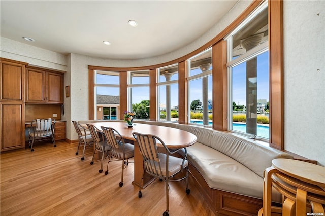 dining area featuring breakfast area and light wood-type flooring