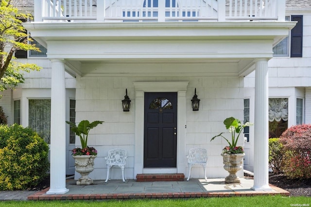 1345 Harbor Rd, Hewlett Harbor, NY 11557 - property entrance featuring a balcony and covered porch