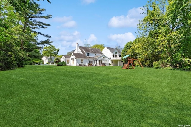 1345 Harbor Rd, Hewlett Harbor, NY 11557 - view of green lawn with a playground