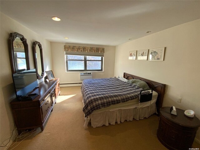 5 Schenck Ave Unit 3E, Great Neck, NY 11021 - bedroom featuring a baseboard radiator, carpet floors, a wall mounted air conditioner, and recessed lighting