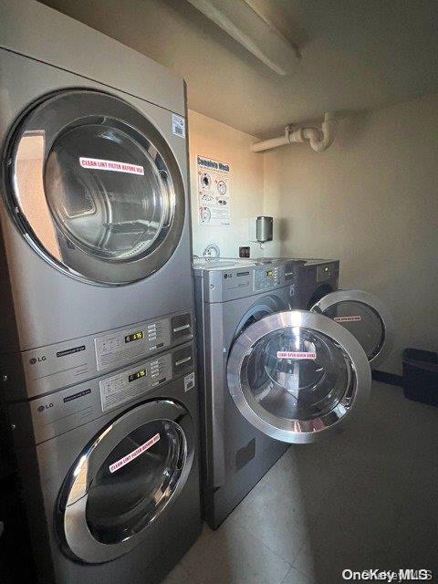 laundry room with stacked washer and clothes dryer