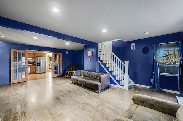 living room featuring hardwood / wood-style flooring and french doors