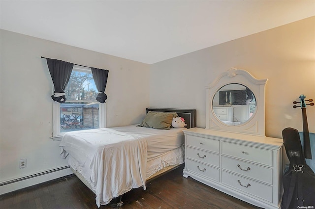 bedroom with dark hardwood / wood-style flooring and a baseboard radiator