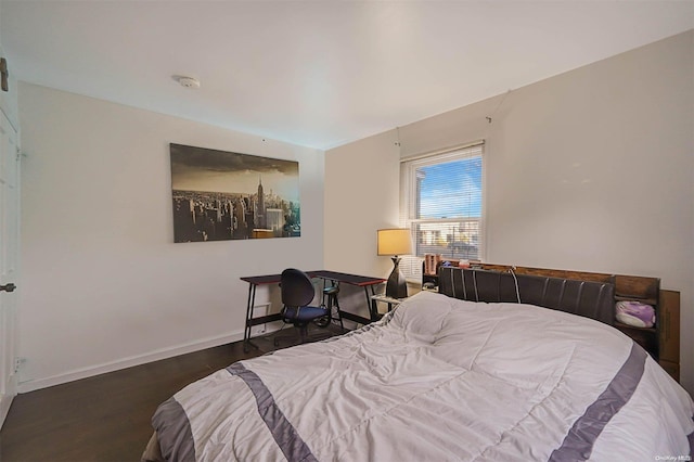 bedroom featuring dark hardwood / wood-style floors