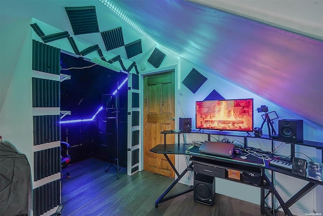 rec room featuring hardwood / wood-style floors and lofted ceiling